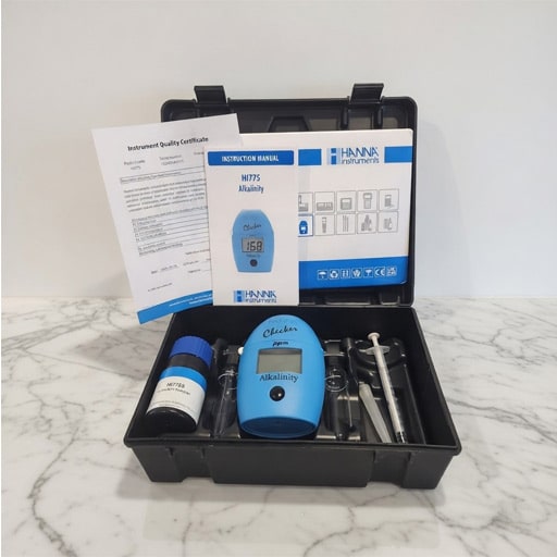 Hanna HI775 digital alkalinity checker being used to test freshwater aquarium parameters.